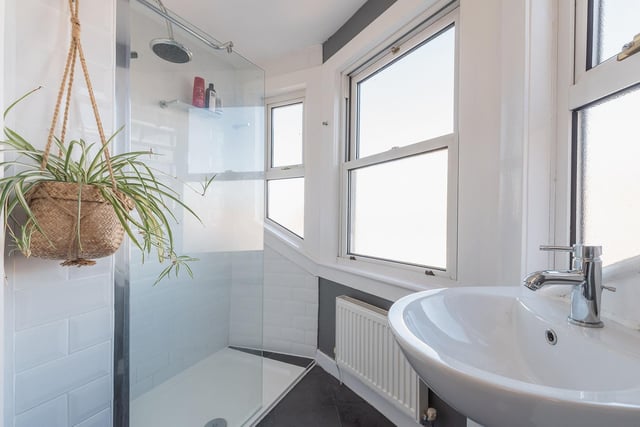 The property also includes this contemporary walk-in shower room.