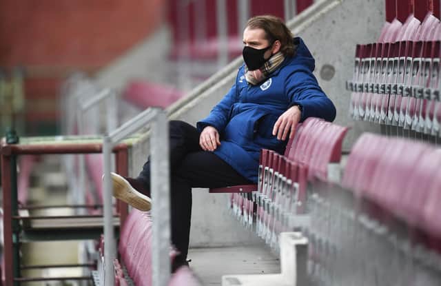 Robbie Neilson watches on from the Wheatfield Stand.