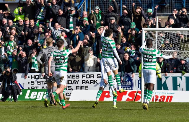 Celtic players celebrate in front of the away fans at Dens Park in 2019. Picture: SNS