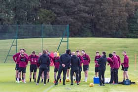 The Hearts squad will meet on Friday to discuss if they will accept the Championship trophy.