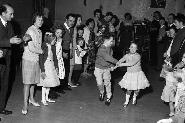 In January 1964, children were enjoying the RAF Association's Children's Christmas Party in the Grassmarket.