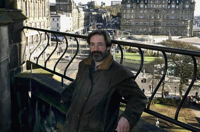 Crime-writer James Oswald with the North British, or is it The Balmoral, in the background