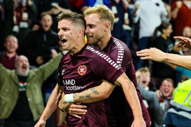 Hearts' Nathaniel Atkinson celebrates as with Cammy Devlin as he scores to make it 3-1 against Rosenborg. Pic: SNS