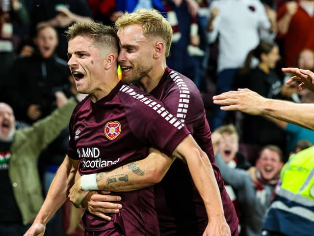 Hearts' Nathaniel Atkinson celebrates as with Cammy Devlin as he scores to make it 3-1 against Rosenborg. Pic: SNS