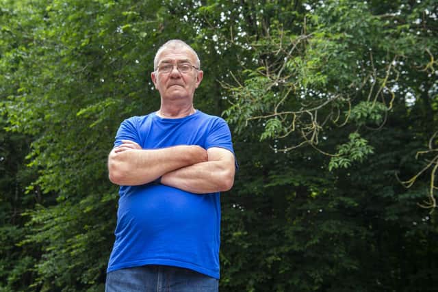 Hugh Stewart says he was forced to spend £600 to pay someone to cut back the trees about two years ago because bosses at Mortonhall Caravan & Camping Park refused to do so. Pictures: Lisa Ferguson
