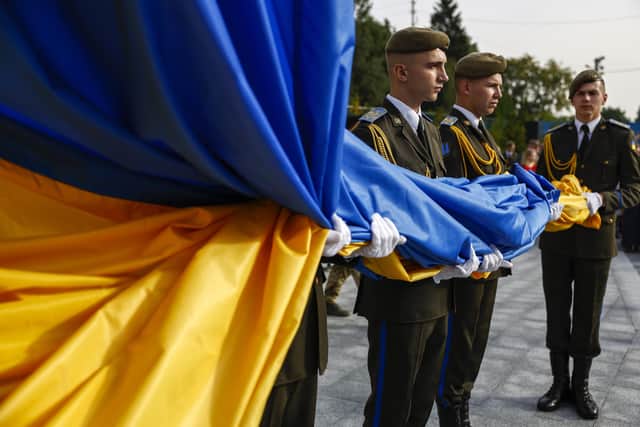 The National Flag of Ukraine is raised at the Hetman Petro Sahaidachny National Ground Forces Academy yesterday (Picture: Jeff J Mitchell/Getty Images)