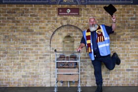 David O'Donnell poses with the Harry Potter Platform 9 ¾ trolley that was unveiled today at Edinburgh Waverley train station.