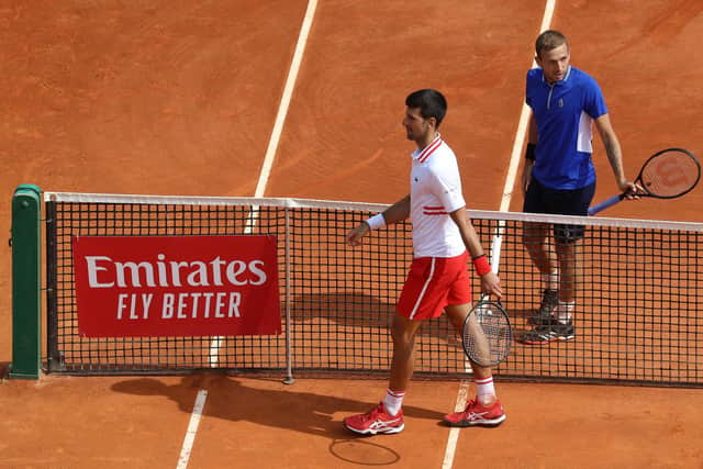 Novak Djokovic and Dan Evans leave the court after the latter's stunning victory in the third round of the Monte Carlo Masters Series. Picture: Valery Hache/AFP via Getty Images