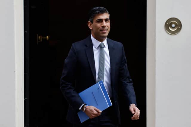 Chancellor Rishi Sunak leaves 11 Downing Street on his way to deliver his Spring Statement in the House of Commons (Picture: Tolga Akmen/AFP via Getty Images)
