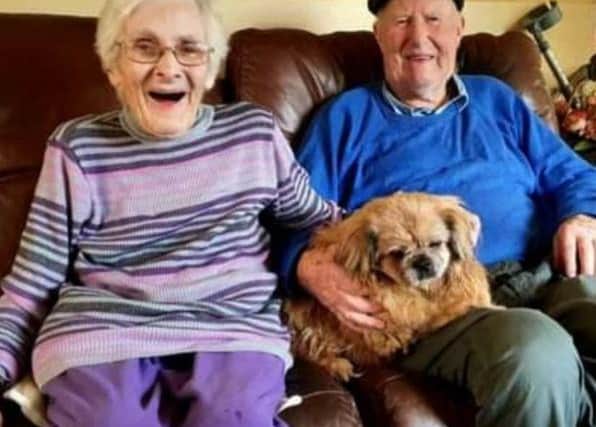 Mrs Pringle, who sadly passed away last month, with Mr Pringle and their dog Buddy.