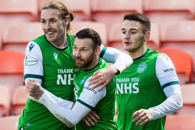 Hibs' goalscorer Martin Boyle celebrates with the man who set up the opportunity, Jackson Irvine, and Kyle Magennis. Photo by Ross Parker / SNS Group