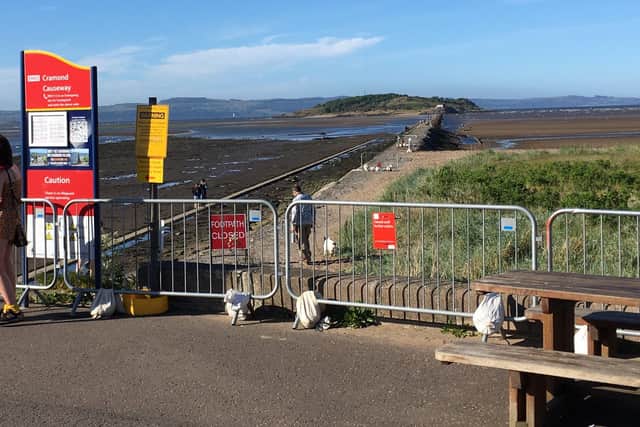 A picture shared on social media shows people going beyond the safety barrier at Cramond.