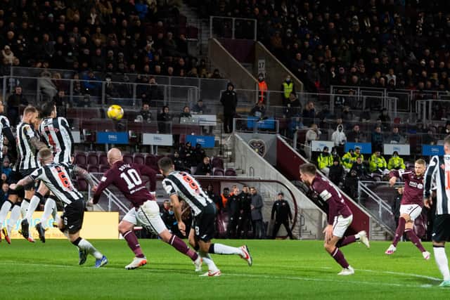 Stephen Kingsley curls home Hearts' second goal from all of 30 yards.