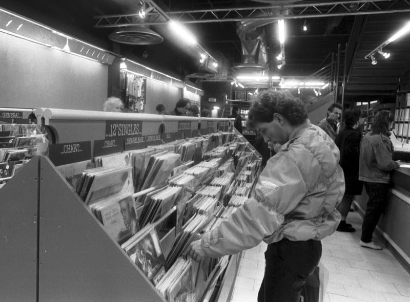 The Other Record Shop moved from the High Street to Princes Street in Edinburgh in December 1985. A man browses the 12" singles.