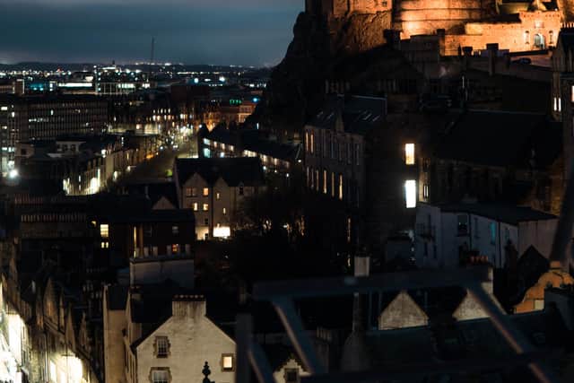 The video shows them at dangerous heights with panoramic views of Edinburgh