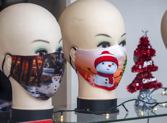 Christmas-themed face masks on sale in Edinburgh, which remains in tier three