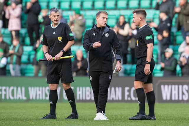 Motherwell manager Steven Hammell speaks to referee Grant Irvine at full time after Hibs' 1-0 win. Picture: SNS