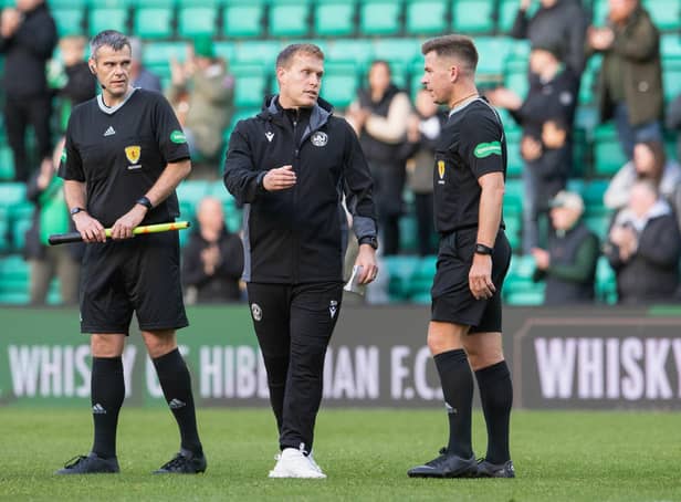 Motherwell manager Steven Hammell speaks to referee Grant Irvine at full time after Hibs' 1-0 win. Picture: SNS
