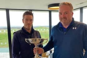 The Renaissance Club's Ross Noon, left, is presented with The Uniroyal Trophy by Edinburgh & East of Scotland Golfers' Alliance president Donny Munro after his win at Gullane earlier in the year.