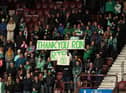 The crowd paid tribute to Hibs owner Ron Gordon who passed in the week. Credit Michael Hulf