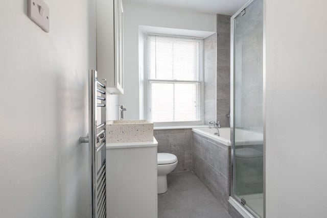 The property includes an immaculate fully tiled bathroom with a three piece suite, separate walk in shower and a lovely vanity unit. It also includes a hallway with a useful toilet and under stair storage space.