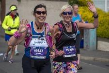 Runners pair up along the route of the Edinburgh marathon on Sunday