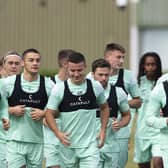 Kyle Magennis, centre, takes part in training along with Elias Melkersen, third left, and Lewis Stevenson, second right