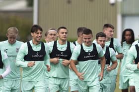 Kyle Magennis, centre, takes part in training along with Elias Melkersen, third left, and Lewis Stevenson, second right