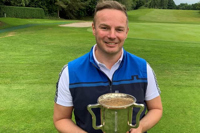 Recent recruit Andy Fairbairn shows off the trophy after his win in the Duddingston championship