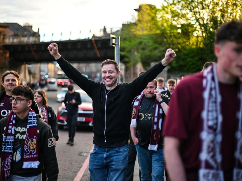 Hearts fans react outside the stadium after their team's victory (Photo by ANDY BUCHANAN / AFP via Getty Images)