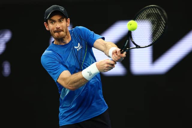 Andy Murray plays a backhand in his second round singles match against Taro Daniel of Japan