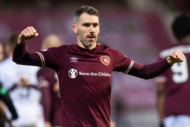 Hearts defender Michael Smith feels the club should be in the Premiership's top four.