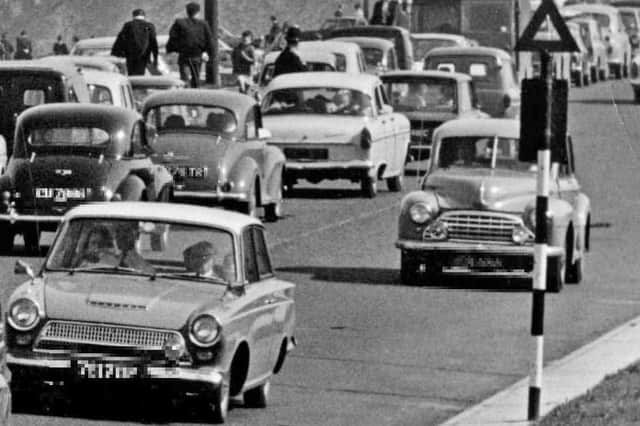 A busy scene on the Coast Road in Marsden but can you identify the cars?