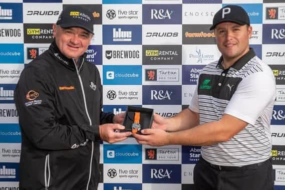 Paul Lawrie, the Tartan Pro Tour founder and commissioner, presents Neil Fenwick with one of his prizes for a win on the Tartan Pro Tour at Pollok in 2020. Picture: Tartan Pro Tour