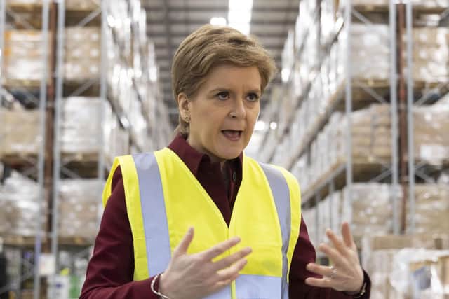 First Minister Nicola Sturgeon at NHS National Services Scotland Titan logistics facility in Bellshill, watching medical supplies being loaded up to be sent over to Ukraine. Picture date: Wednesday March 2, 2022.