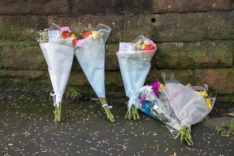 Floral tributes placed near the Anchor Inn in Granton, Edinburgh, where Marc Webley, aged 38, was killed in a shooting just before midnight on New Year's Eve. 
Photo: Jane Barlow/PA Wire
