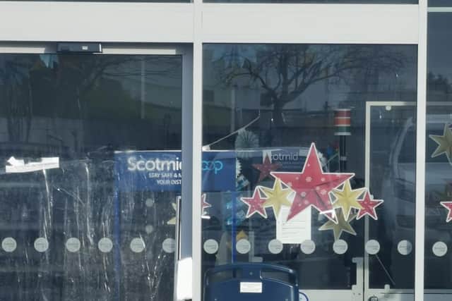 The smashed front door at the Scotmid in Currie. Picture: contributed.