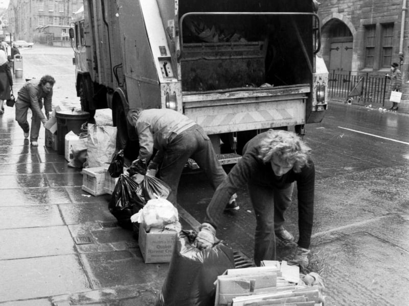 When the strike ends, Edinburgh's dustmen get back to work clearing the rubbish from Easter Road in March 1982.