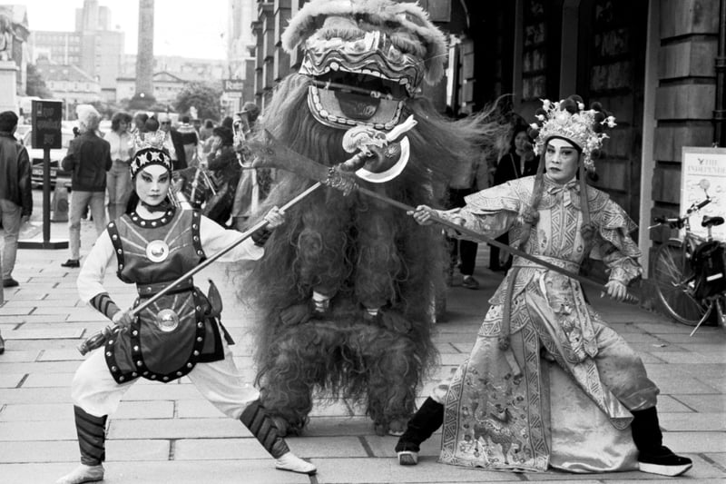Members of the Chinese Theatre Circle in traditional costume performed the Lion Dance outside the Assembly Rooms in George Street to promote their Edinburgh Festival Fringe show, August 1988.
