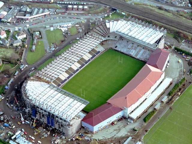 Aerial photo of Murrayfield Stadium as construction work continued in November 1992. The first phase was completed in January 1993 with the new north and south stands opening. In February 1994 the centre section of the new West Stand opened. In 1994, Murrayfield completed a £50-million renovation where floodlights were installed for the first time.