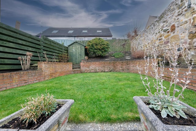 The rear garden features a patio, good sized lawn and storage cupboard. The garden shed is included in the sale.