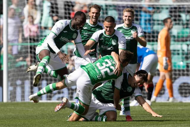 Josh Campbell is mobbed by his team-mates after levelling late on against Rangers.