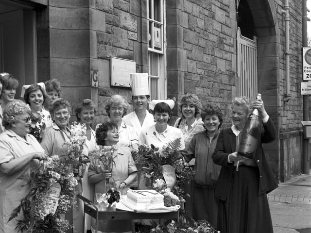 Nurses and staff from Bruntsfield Hospital in Whitehouse Loan Edinburgh celebrate the hospital's centenary with champagne and flowers in June 1985.