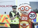 Edinburgh's roll-out of the 20mph speed limit was promoted by super-hero mascot The Reducer. Picture: Greg Macvean.
