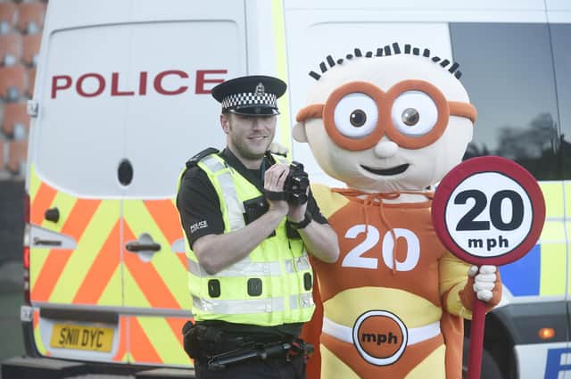 Edinburgh's roll-out of the 20mph speed limit was promoted by super-hero mascot The Reducer. Picture: Greg Macvean.