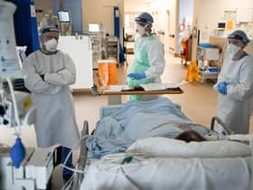 Staff at University Hospital Monklands attend to a Covid-positive patient on the ICU ward on February 5, 2021 in Airdrie, Scotland. TPhoto by Jeff J Mitchell/Getty Images