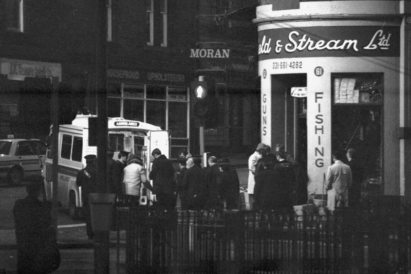 A man shut himself in the Field and Stream gun shop in Montrose Terrace Edinburgh, November 1985. By late evening the man had given himself up and was taken away in an ambulance.