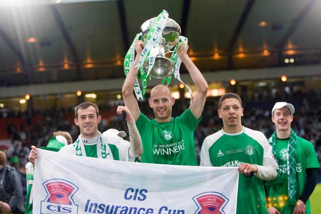 Hibs captain Rob Jones holds aloft the CIS Cup after the 5-1 win over Kilmarnock at Hampden on March 18, 2007. Pic: SNS