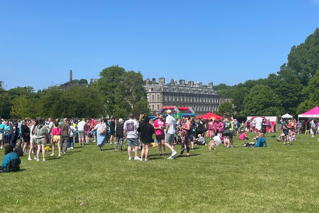 Runners and spectators are pictured here on the grass at Holyrood Park during Sunday's Race For Life.