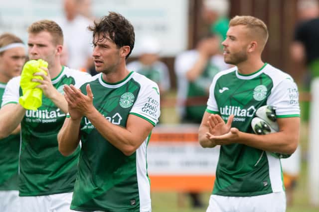 The Terry Healy Group logo can be seen on the Hibs players' shirt sleeves